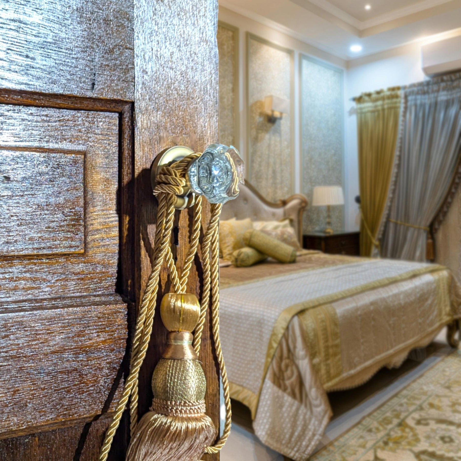 Crystal door knob reflecting light on a white interior door.